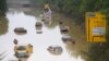 Submerged cars and other vehicles are seen on the federal highway B265 in Erftstadt, western Germany, on July 17, 2021,