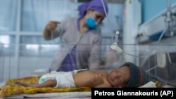 A nurse takes care of a baby in the neonatal intensive care unit of the Malalai Maternity Hospital in Kabul in December.