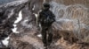  A Polish soldier patrols the Polish-Belarusian border near Czeremcha village in eastern Poland.