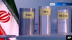 Three versions of domestically-built centrifuges are shown in an Iranian state-TV program in 2018. (file photo)