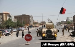 Afghan government forces fighting alongside a civilian militia in Herat on August 4.