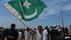 Pakistani and Afghan Pashtuns gather at a rally in Islamabad in July 2015. 