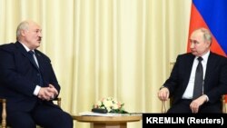 Russian President Vladimir Putin (right) meets with Belarusian ruler Alyaksandr Lukashenka outside Moscow on February 17.