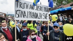 Protesters gather during a rally in Sarajevo on May 30, 2020, to protest against the allegedly high level of corruption in the Bosnian government.
