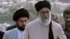 Mojtaba Khamenei (left) walks behind his father, Supreme Leader Ayatollah Ali Khamenei. (file photo)