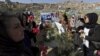 FILE: Afghan women rights activists protest on the grave of 27-year-old woman, Farkhunda, who lynched by a mob in Kabul in Kabul in March 2015.
