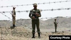 Iranian soldiers guard the border with Afghanistan and Pakistan in Iran's Sistan-Baluchistan Province. Security forces frequently clash with drug traffickers in the province. (file photo)