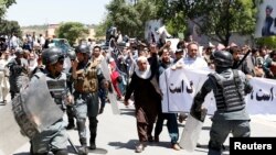 Afghan riot police clashed with demonstrators during an antigovernment protest in Kabul on June 2. At least five people were killed in the violence.