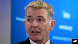 Глава MI6 Ричард Мур 