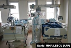 Medical staff attend to COVID-19 patients inside the intensive care unit at the Emergency Institute in Chisinau.