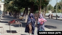 The Taliban forced women to cover themselves from head to toe.
