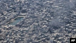 Orașul Gaza City este parțial distrus de bombardamentele israeliene.