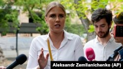 Lyubov Sobol speaks to the media as she arrives at a court in Moscow in August.