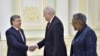 Uzbek President Shavkat Mirziyoyev (left) meets with U.S. Undersecretary of State Thomas Shannon (center) in Tashkent on March 26.