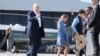 US President Donald Trump walks with his grandchildren, Chloe and Tristan, before boarding Air Force One, Tuesday, July 29, 2025, at Royal Air Force Lossiemouth en route to return to Washington. 
