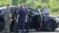 A car and employees of security services are seen at the scene where the body of former Russian Transport Minister Roman Starovoit was found. According to the Russian Investigative Committee, the body of Roman Starovoit with a gunshot wound was found in his car, the main version is suicide.