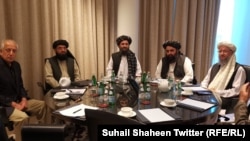 U.S. special representative Zalmay Khalilzad (left) and senior Taliban officials spoke by phone with U.S. President Donald Trump on March 4.