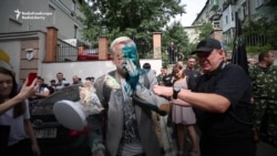 Ukrainian Activist Attacked With Green Chemical Liquid, Cream Pies