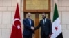 Turski ministar vanjskih poslova Hakan Fidan rukuje se s Ahmadom al-Sharaom, ranije poznatim kao Abu Mohammed al-Golani tokom njihovog sastanka u Damasku, Sirija, 22. decembra 2024. 