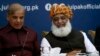 FILE: Pakistan's opposition leaders, Shehbaz Sharif (L) and Maulana Fazlur-Rehman during a meeting in Islamabad in July.