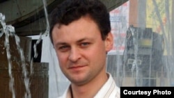 Олег Топоровский, автор стихов к песне "Райский сад у реки – Астана!". 