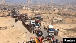 Palestinezët e zhvendosur ikin drejt jugut pasi forcat izraelite urdhëruan banorët e Qytetit të Gazës të evakuohen në jug, 20 shtator.