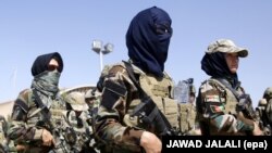 Afghan soldiers secure the scene of an attack allegedly carried out by the Islamic State militants in the capital Kabul in July.