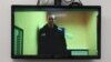 Alexei Navalnîi, în timpul unei legături video într-o ședină de judecată a tribunalului din Moscova, în aprilie. 