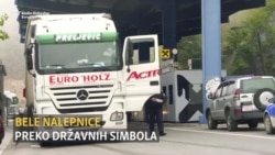 Nalepnice preko državnih simbola između Srbije i Kosova