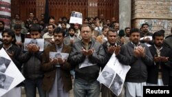File photo of journalists from the Balochistan Union Of Journalists praying for their colleague Imran Sheikh, who was killed in a bomb attack in January 2013.