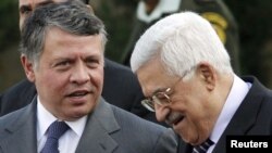 Mahmud Abbas (right) speaks with Jordan's King Abdullah II during a welcoming ceremony in the West Bank city of Ramallah last November.