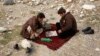 Afghanistan -- Men play chess in Kabul January 13, 2014.