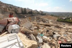 Urmările unui bombardament israelian la Ain Deleb, în Liban, luni, 30 septembrie. Israelul spune că vrea să ducă la capăt „ce a început” în țara vecină de la nord. Casa Albă ar prefera ceva mai limitat.