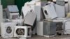 Old electrical appliances in container of recycling center.
