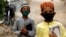 Boys wearing protective masks head to the madrasah in Karachi in July.