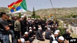 Pjesëtarë të komunitetit druz në Lartësitë e pushtuara të Golanit.