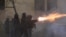 Police in riot gear fire tear gas during a fourth day of nationwide protests against a government decision to shelve EU membership talks in Tbilisi early on December 2, 2024.