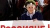 A woman holds a sign saying "Russians!" at a demonstration in Transdniester (file photo)
