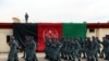 FILE: Afghan policemen march during their graduation ceremony in Helmand, February 2018.