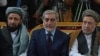 FILE Afghan Chief Executive Abdullah Abdullah (C) sits with his two deputies Mohammad Khan (left) and Mohammad Mohaqiq during a gathering in Kabul in October 2013.