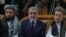 FILE Afghan Chief Executive Abdullah Abdullah (C) sits with his two deputies Mohammad Khan (left) and Mohammad Mohaqiq during a gathering in Kabul in October 2013.