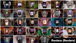 Indiai koronavírus-áldozatok hozzátartozói elhunyt szeretteik fotójával