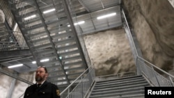 Tomi Rask, emergency planning officer at the Helsinki rescue department, is pictured at a civil defense underground shelter that is also used as a sports hall. (file photo)