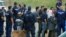 Asylum seekers wait to board a bus near the Hungarian-Serbian border last year. (file photo)