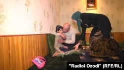 Maryam Shoeva is reunited with her grandparents in Dushanbe after a monthslong effort by Tajik authorities to repatriate her. 