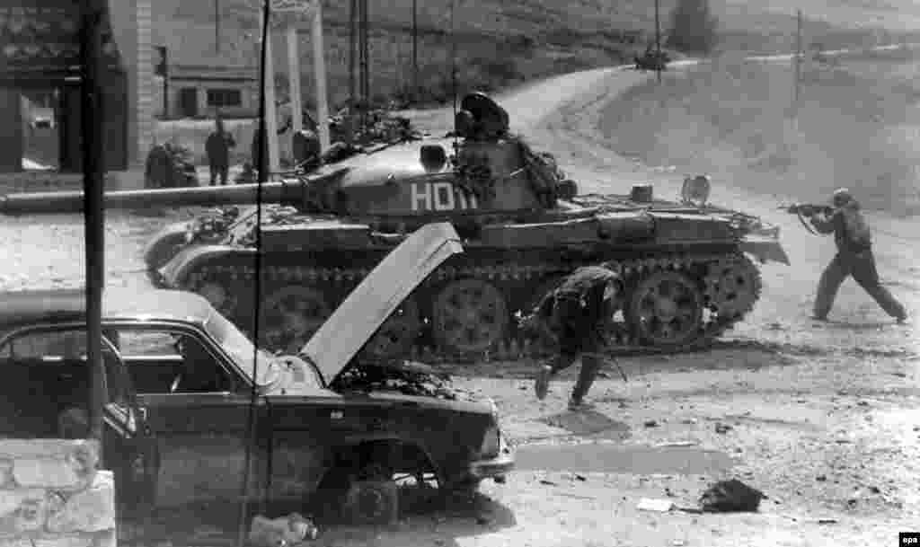 Russian soldiers fight militants after insurgents crossed into neighboring Daghestan and launched attacks, one of the catalysts of the second post-Soviet war in Chechnya.