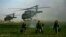 FILE: U.S. army special forces walk in a field as Blackhawk helicopters transporting NATO officers land in Marjah's Balakino Bazar neighborhood in 2010.