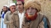 Pakistanis displaced from South Waziristan wait to get relief at a camp in Dera Ismail Khan.