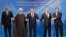 Left to right: Azerbaijani President Ilham Aliyev, Iranian President Hassan Rohani, Kazakh President Nursultan Nazarbaev, Russian President Vladimir Putin, and Turkmen President Gurbanguly Berdymukhammedov pose after the signing ceremony for a new convention on the status of the Caspian Sea on August 12. 