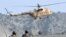 A Pakistani Army helicopter flies as soldiers patrol in Sararogha, South Waziristan (file photo).